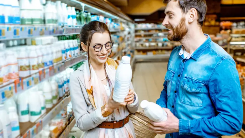 A man and a woman meeting casually in a grocery store